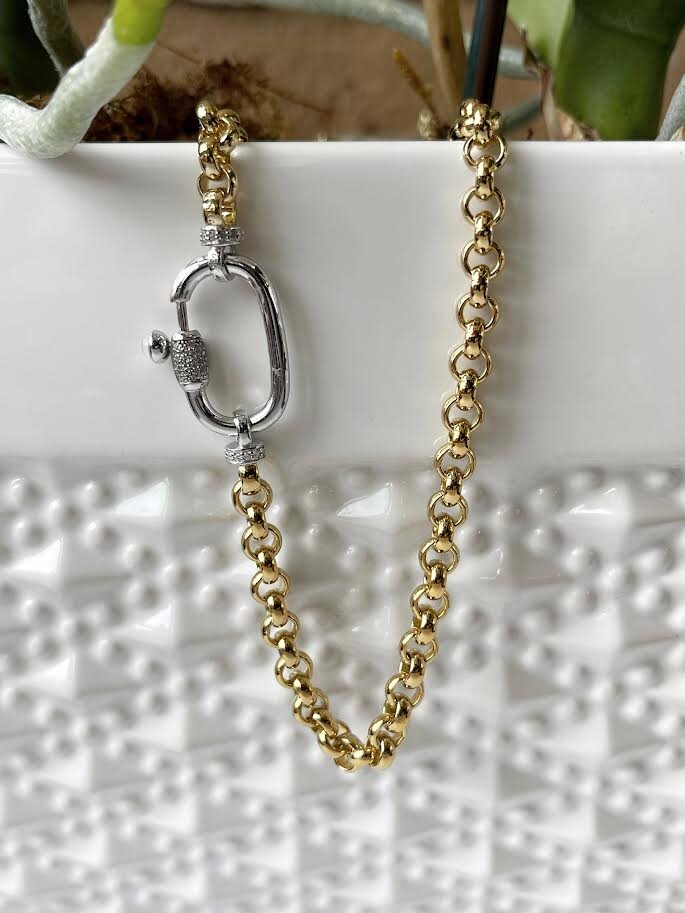 Photo of Heavyweight Fancy Rolo Link in a decorative scene, designed by , available at Plumb Gold & Plumb Silver
