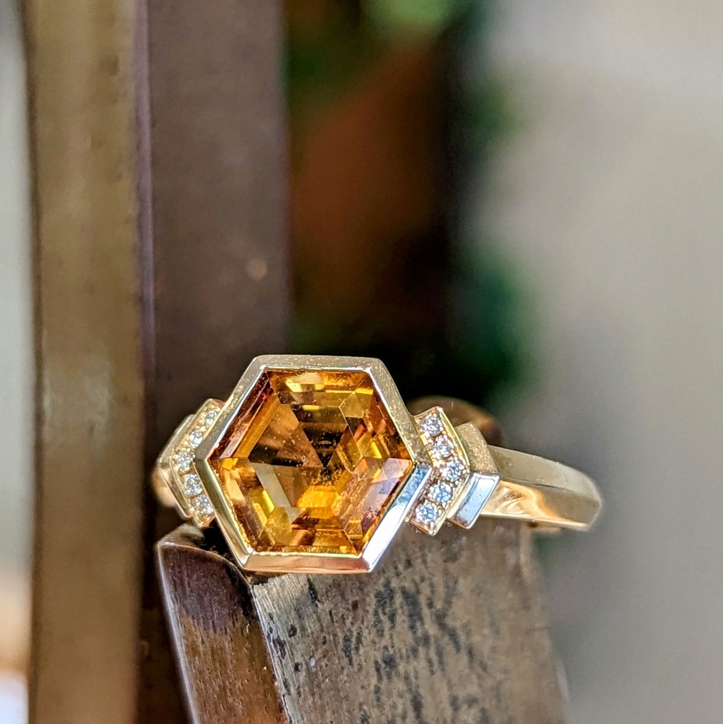 Photo of Hexagon Citrine Ring in a decorative scene, designed by , available at Plumb Gold & Plumb Silver