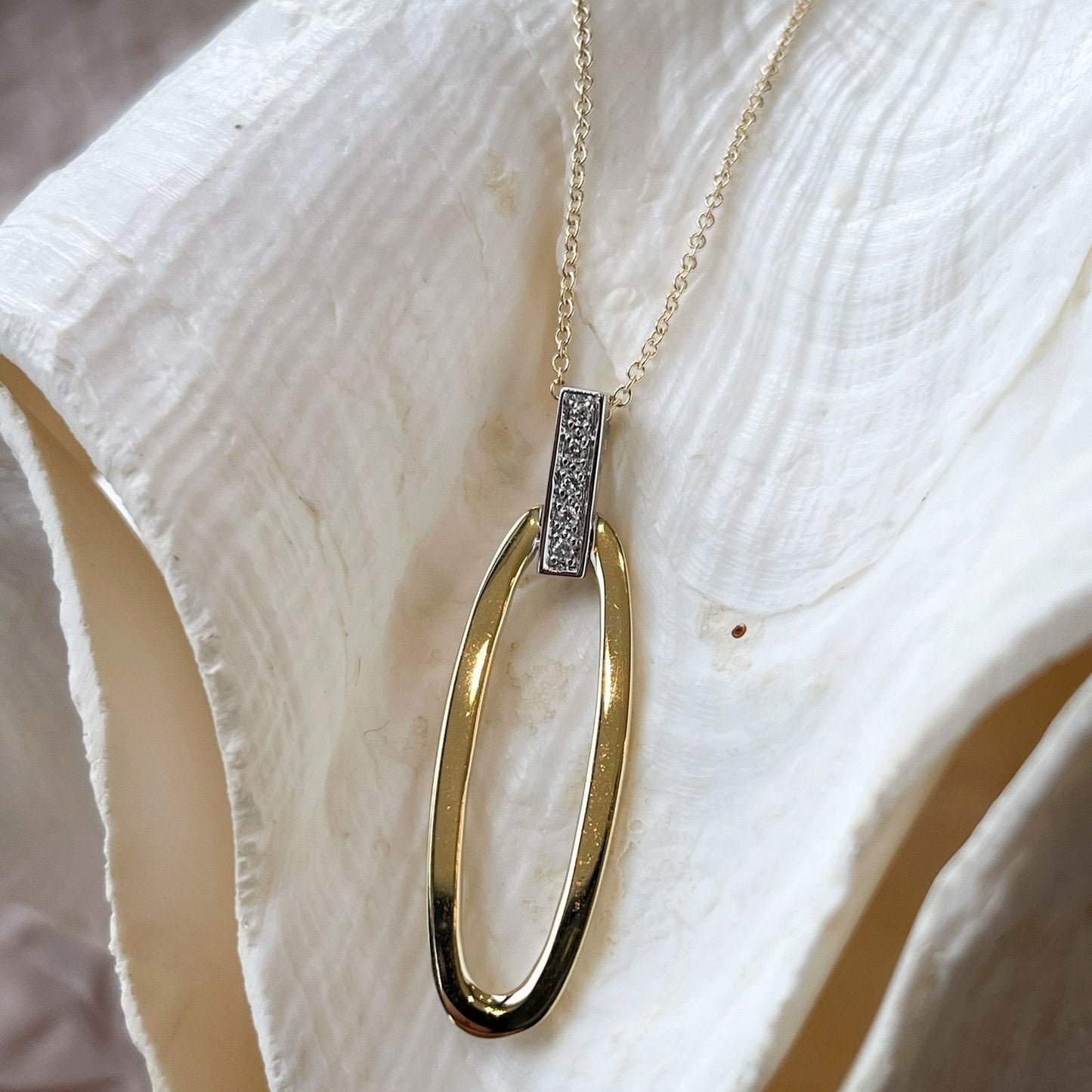 Photo of I. Reiss Oval Necklace in a decorative scene, designed by , available at Plumb Gold & Plumb Silver