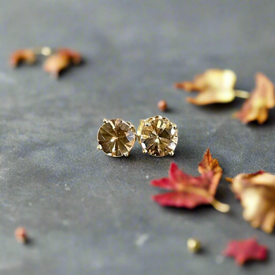 Photo of Imperial Topaz Studs in a decorative scene, designed by -, available at Plumb Gold & Plumb Silver