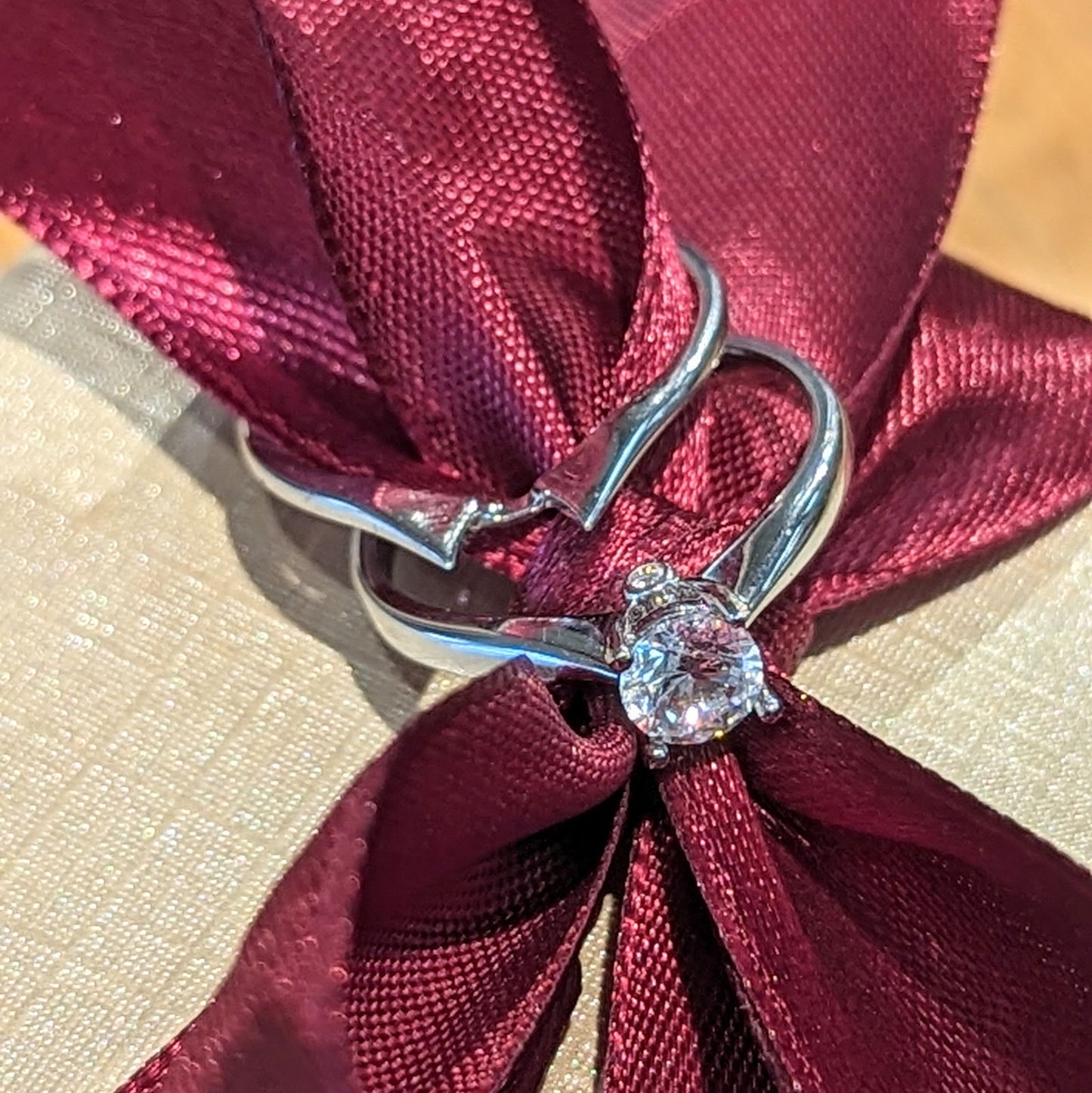 Photo of "Jennifer" Engagement Ring or Band in a decorative scene, designed by , available at Plumb Gold & Plumb Silver