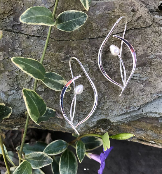 Photo of "Jonquil" Earrings in a decorative scene, designed by , available at Plumb Gold & Plumb Silver