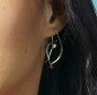 Photo of "Jonquil" Earrings in a decorative scene, designed by , available at Plumb Gold & Plumb Silver