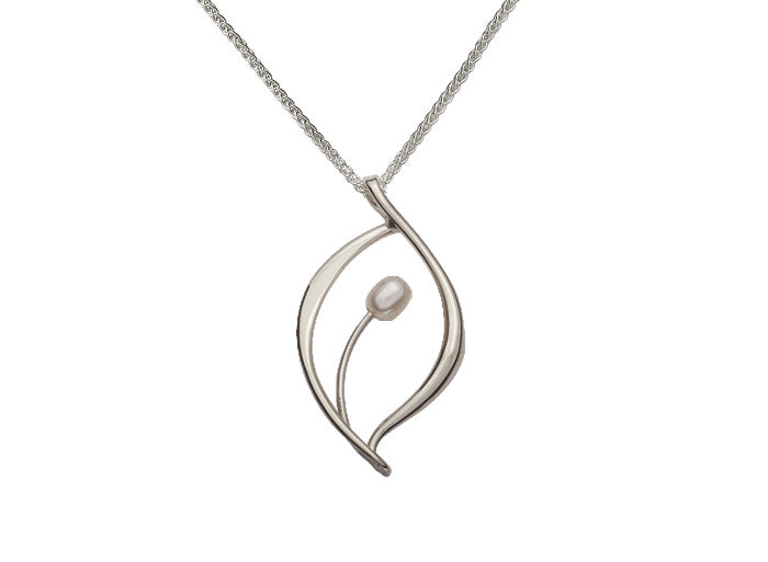 Photo of "Jonquil" Necklace in a decorative scene, designed by , available at Plumb Gold & Plumb Silver