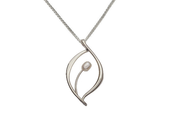 Photo of "Jonquil" Necklace in a decorative scene, designed by , available at Plumb Gold & Plumb Silver