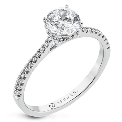 Photo of "Katalina" Hidden Halo Engagement Ring in a decorative scene, designed by , available at Plumb Gold & Plumb Silver