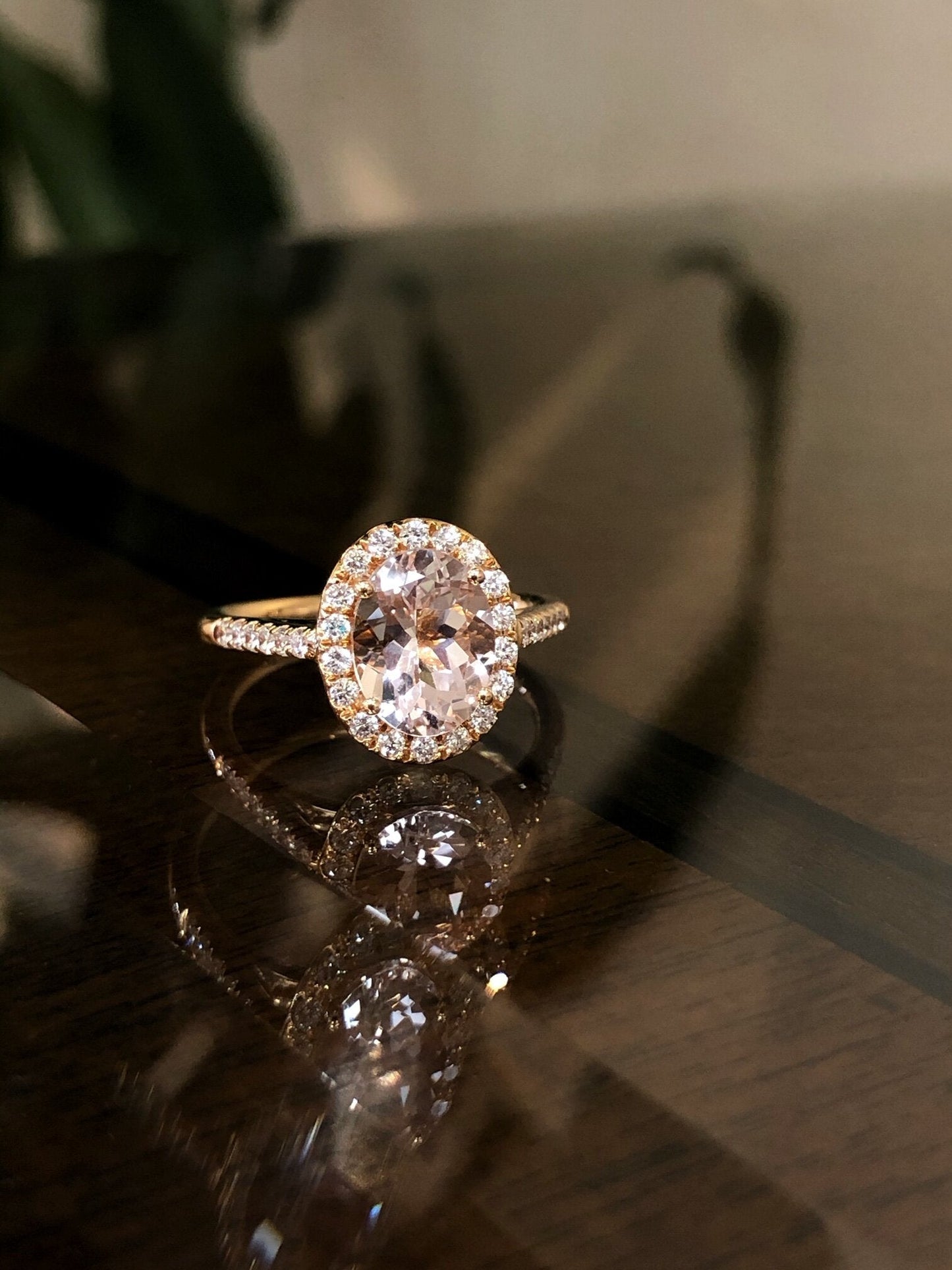 Photo of Kim Collins Oval Morganite Ring in a decorative scene, designed by , available at Plumb Gold & Plumb Silver