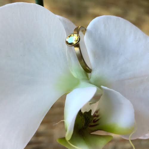 Photo of Kim Collins Yellow Sapphire Yum Drop in a decorative scene, designed by , available at Plumb Gold & Plumb Silver