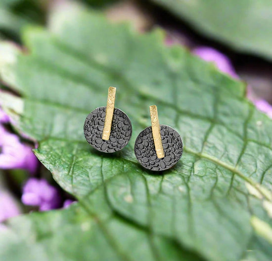 Photo of “Kymbal” Studs in a decorative scene, designed by -, available at Plumb Gold & Plumb Silver