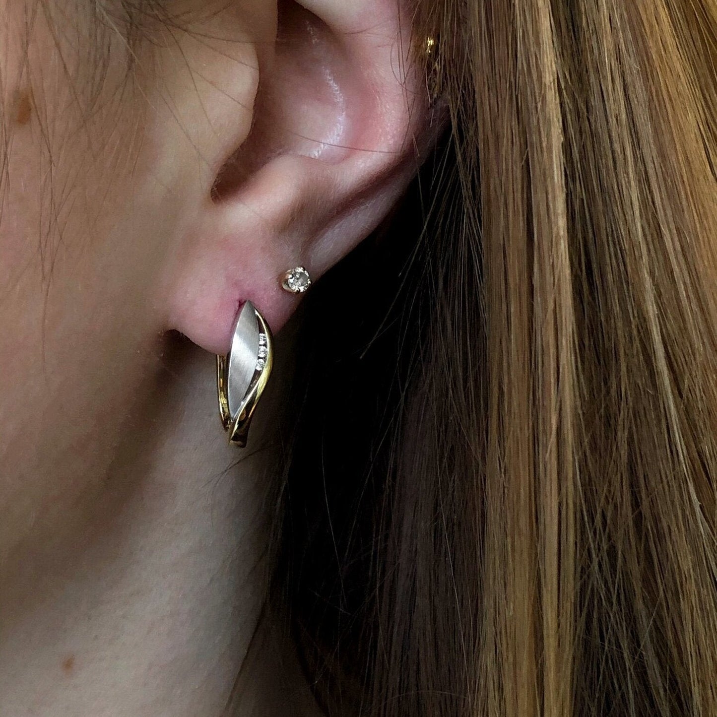 Photo of Leaf Huggies in a decorative scene, designed by , available at Plumb Gold & Plumb Silver