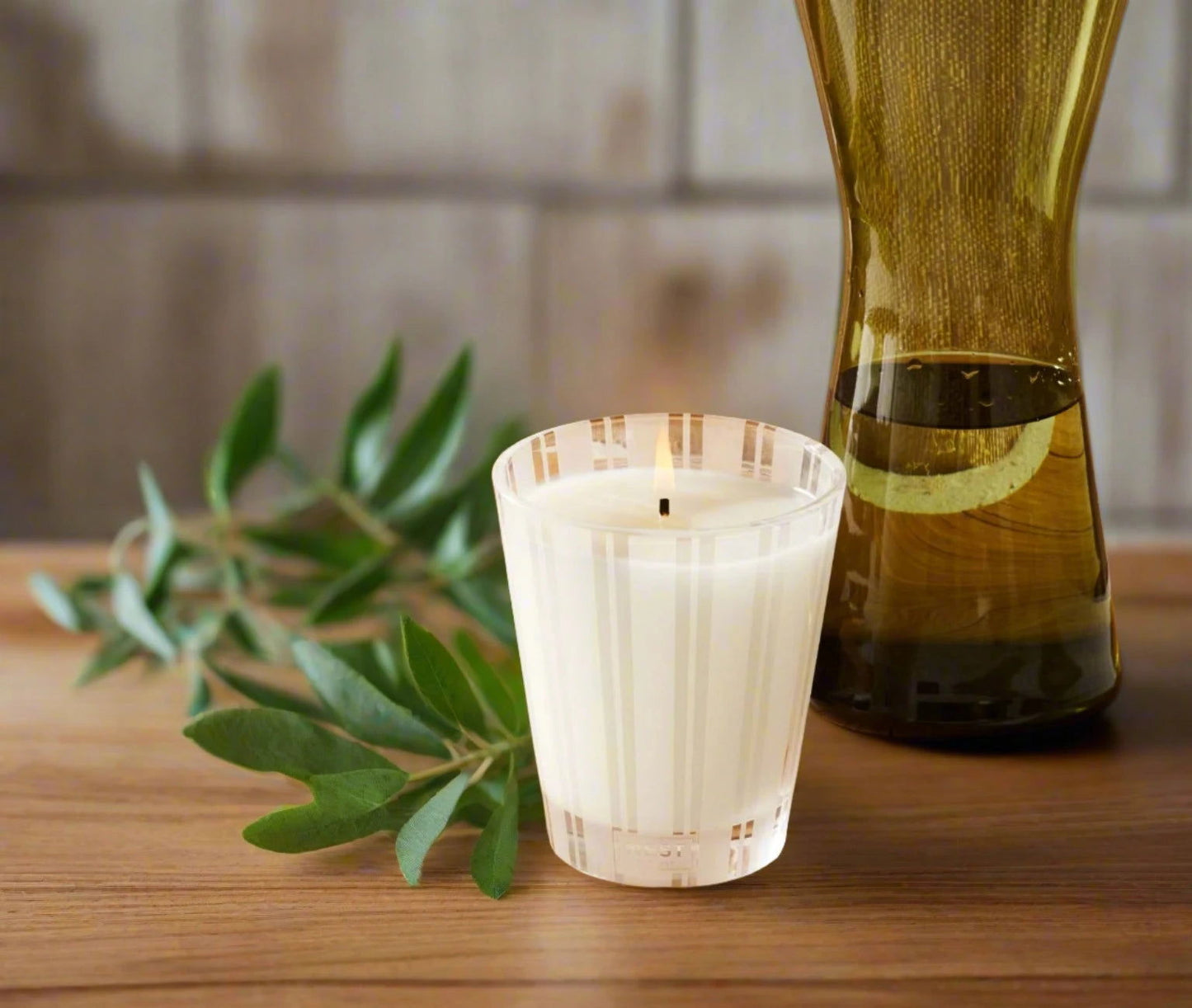 Photo of Lemongrass and Ginger Candle in a decorative scene, designed by , available at Plumb Gold & Plumb Silver