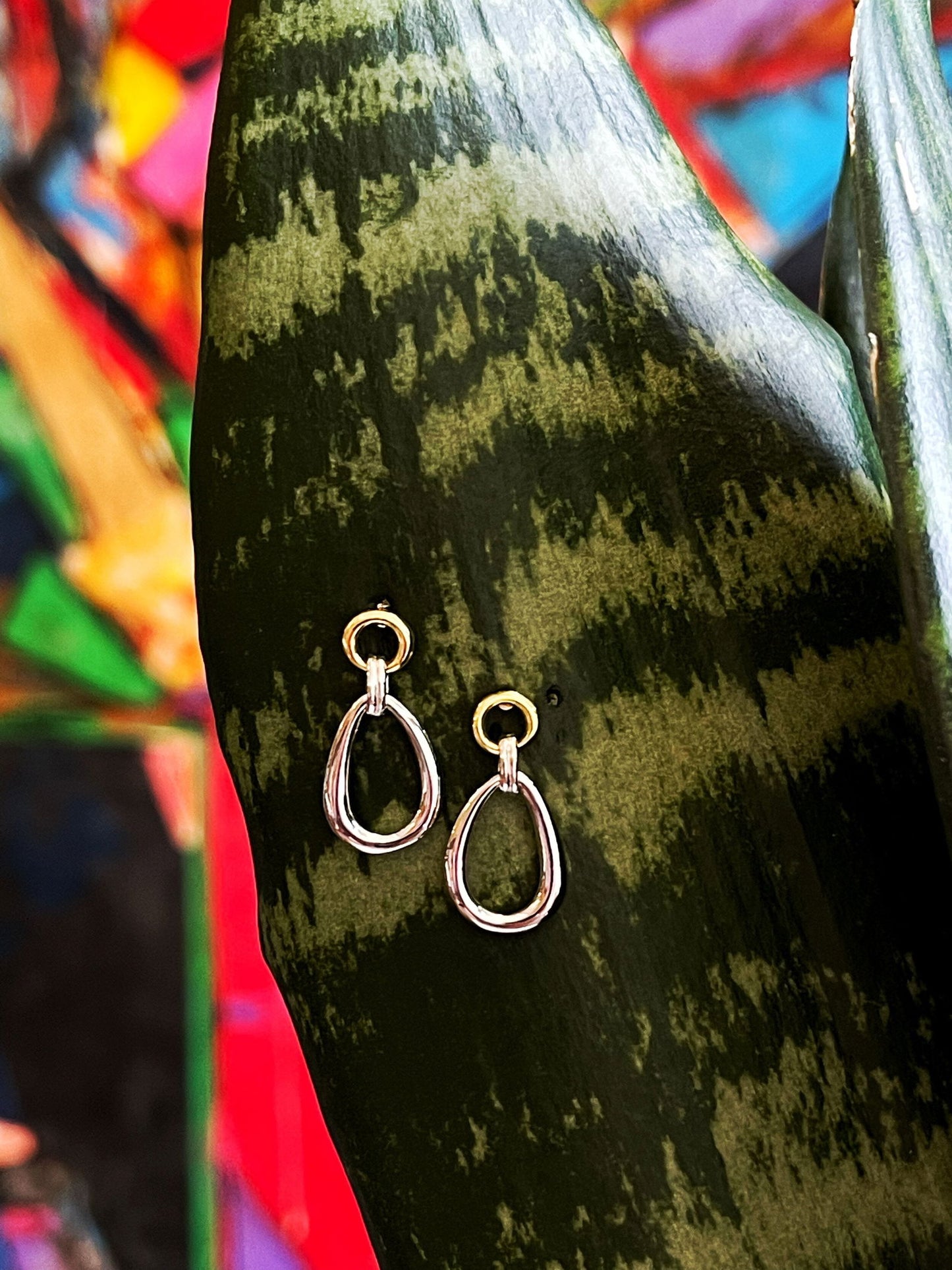 Photo of "Linda" Earrings in a decorative scene, designed by , available at Plumb Gold & Plumb Silver