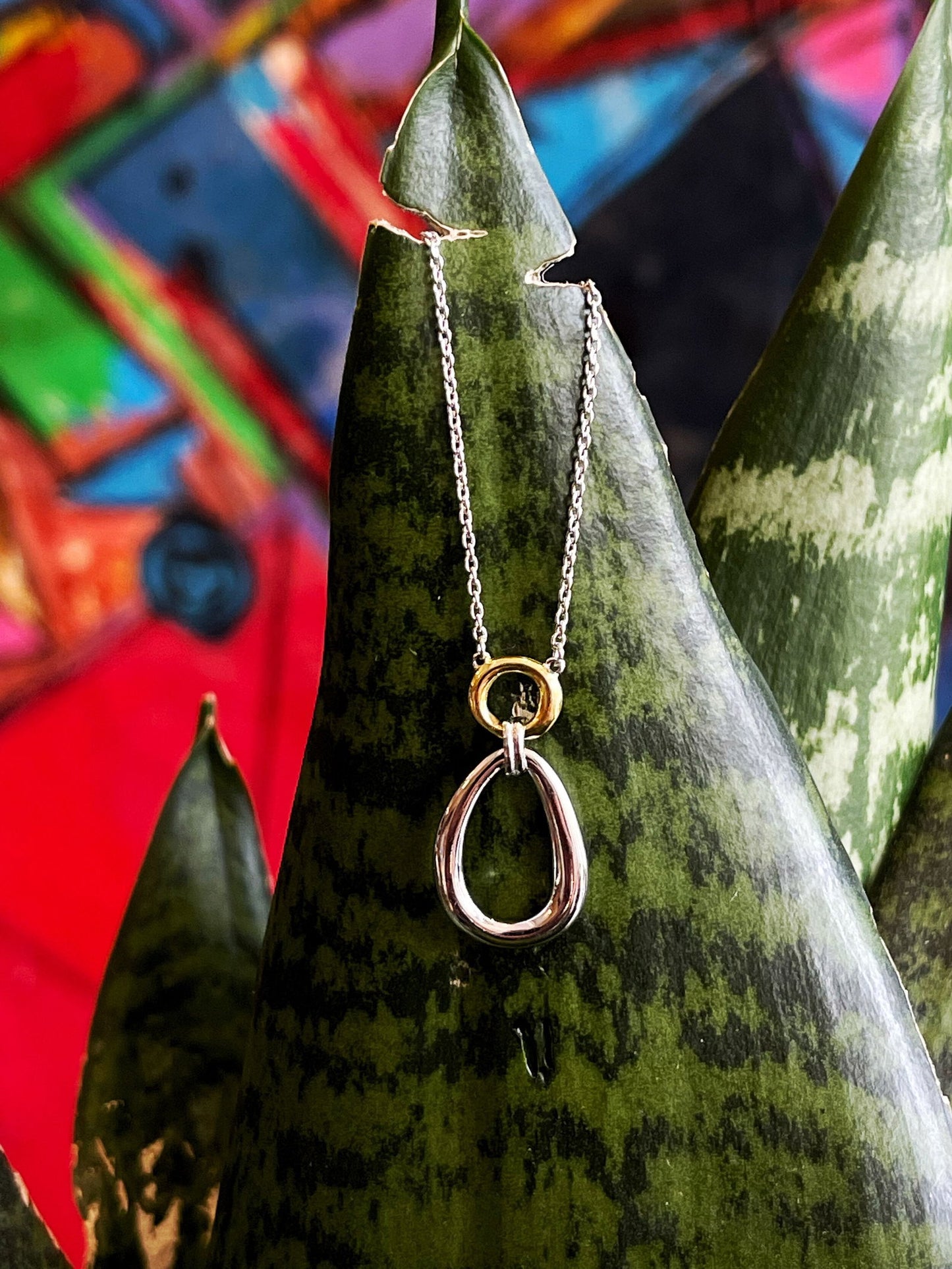 Photo of "Linda" Necklace in a decorative scene, designed by , available at Plumb Gold & Plumb Silver