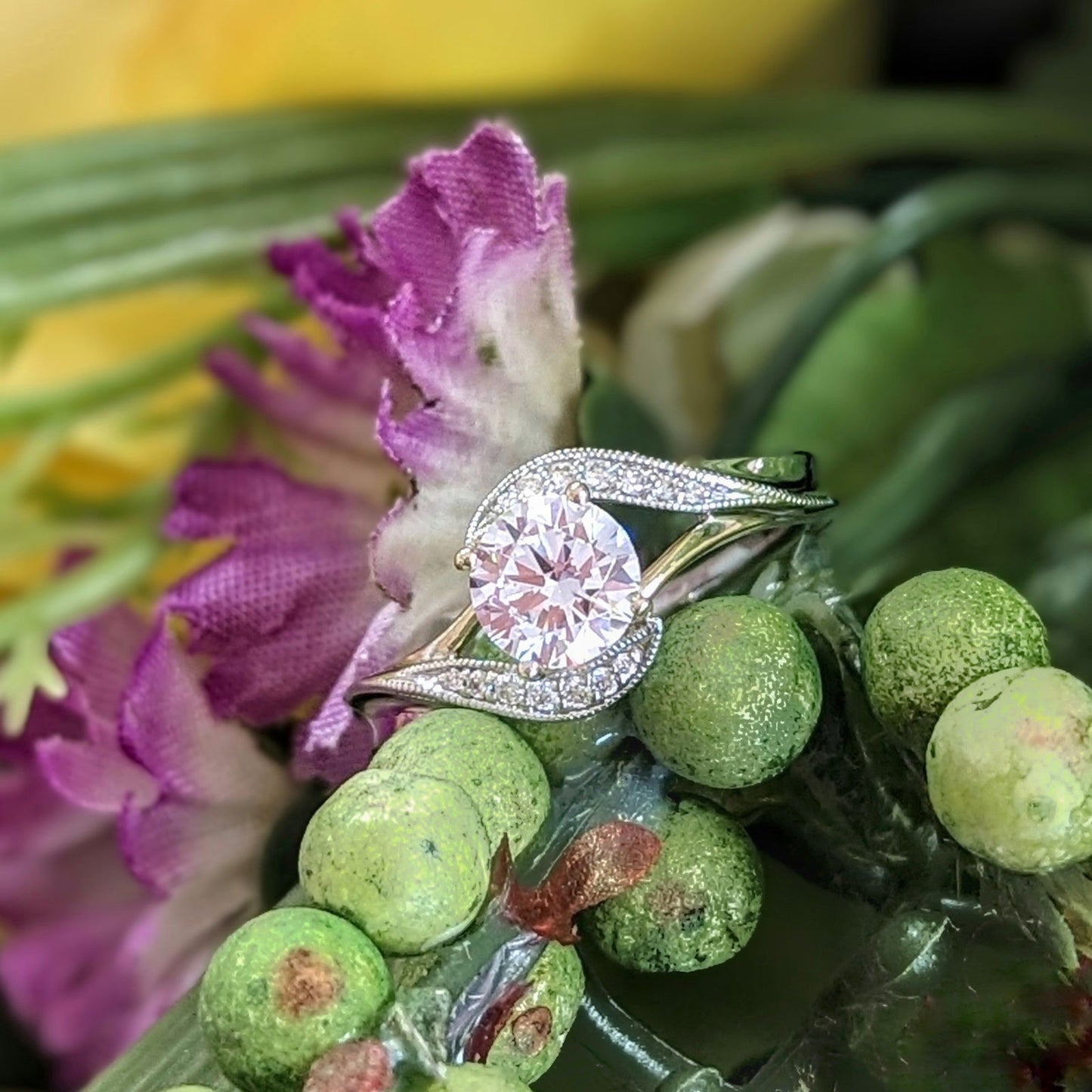 Photo of "Magnolia" Curve Bypass Engagement Ring in a decorative scene, designed by , available at Plumb Gold & Plumb Silver