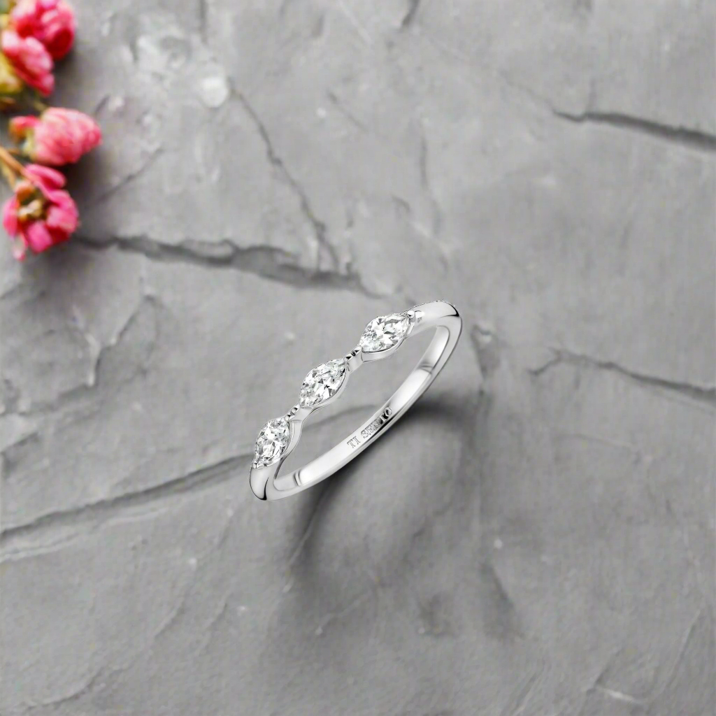 Photo of Marquise Cz Ring in a decorative scene, designed by -, available at Plumb Gold & Plumb Silver