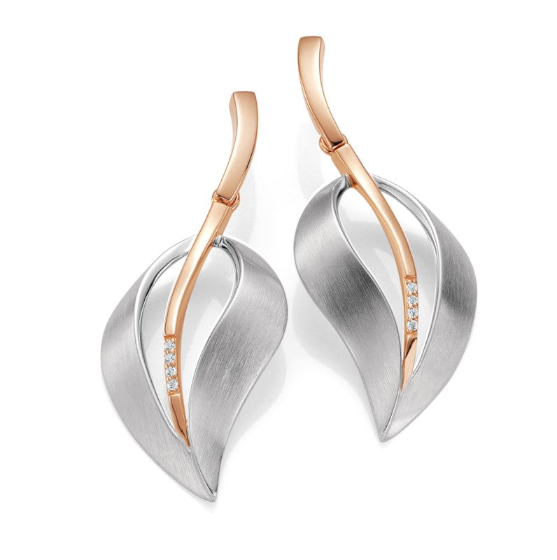 Photo of Matte Silver Leaf Earrings in a decorative scene, designed by , available at Plumb Gold & Plumb Silver