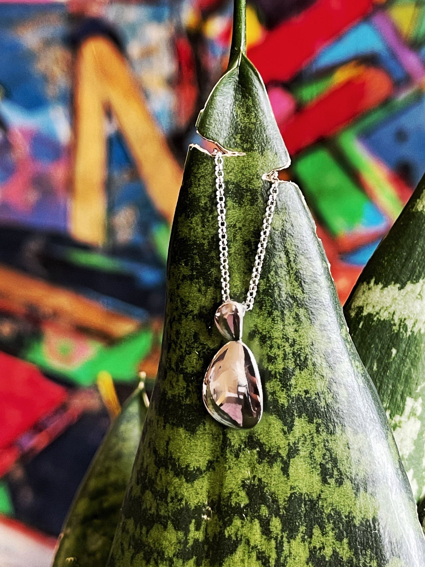 Photo of "Mercury" Pendant in a decorative scene, designed by , available at Plumb Gold & Plumb Silver
