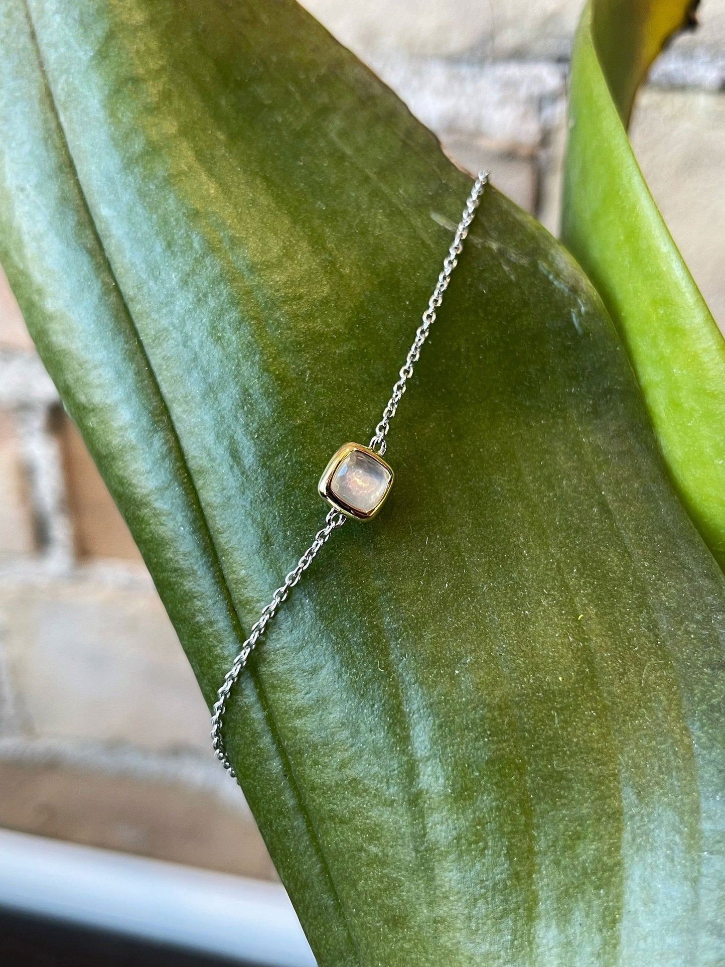 Photo of Mother of Pearl Bracelet in a decorative scene, designed by , available at Plumb Gold & Plumb Silver