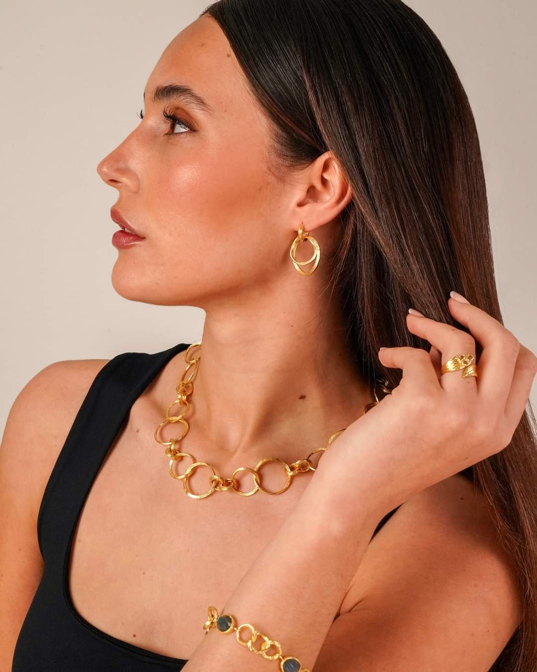 Photo of "Olympia" Earrings in a decorative scene, designed by , available at Plumb Gold & Plumb Silver