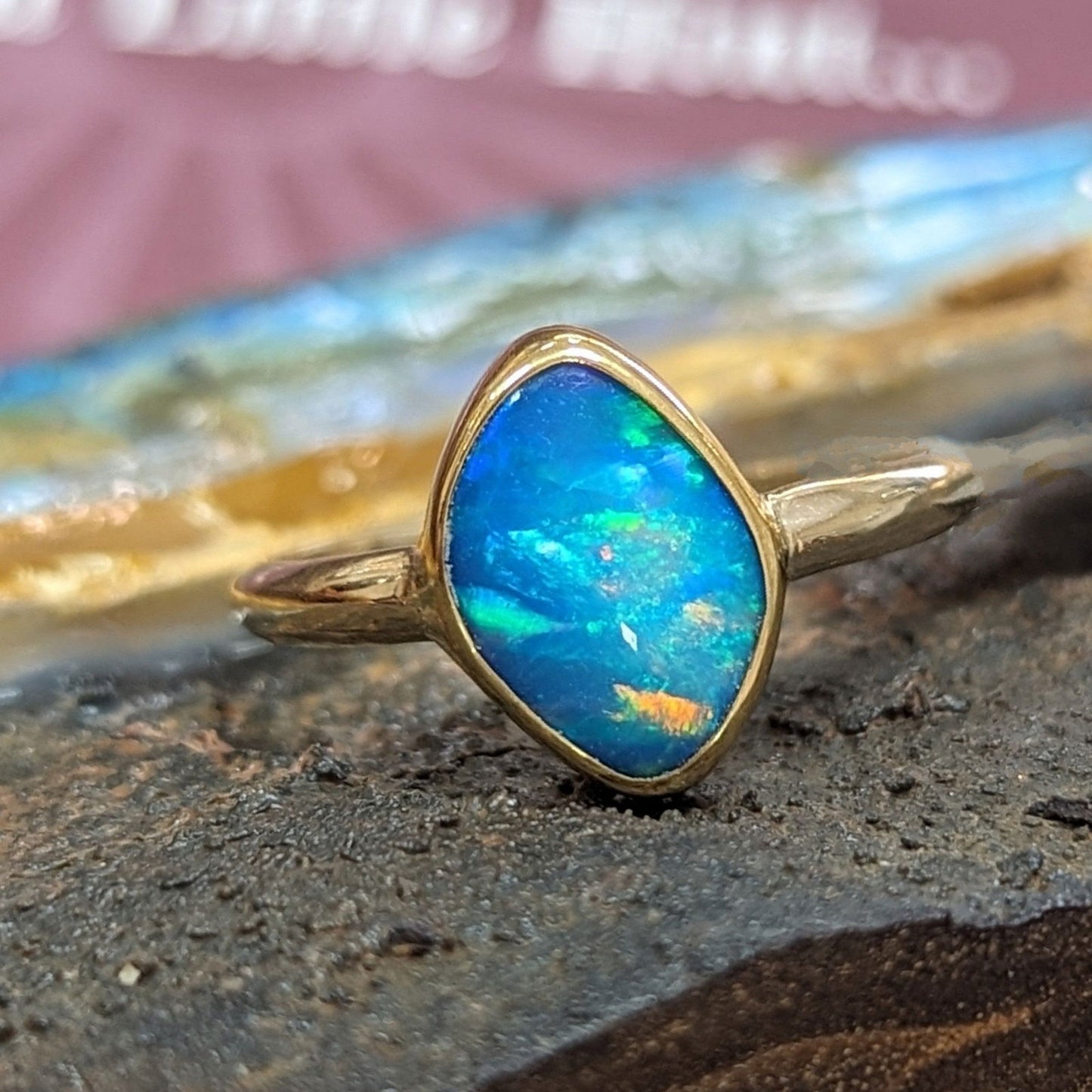 Photo of Opal Ring in a decorative scene, designed by , available at Plumb Gold & Plumb Silver