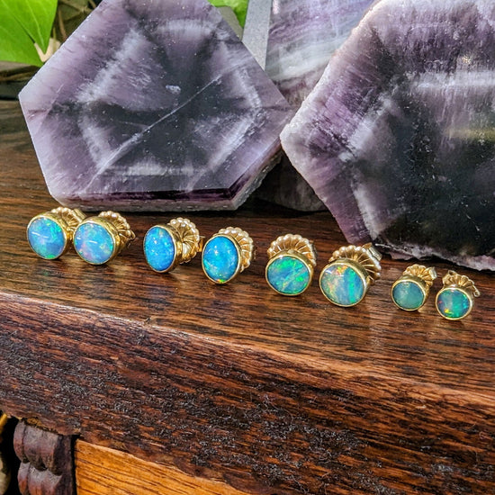 Photo of Opal Studs in a decorative scene, designed by , available at Plumb Gold & Plumb Silver