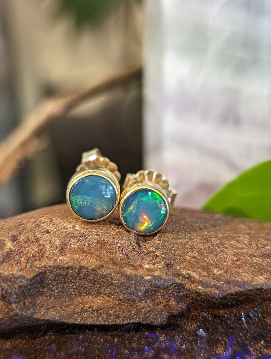Photo of Opal Studs in a decorative scene, designed by , available at Plumb Gold & Plumb Silver