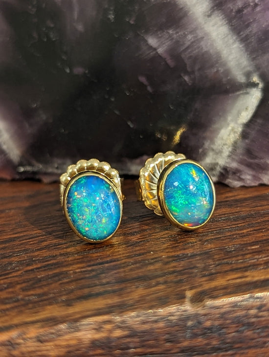 Photo of Opal Studs in a decorative scene, designed by , available at Plumb Gold & Plumb Silver