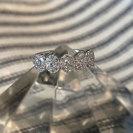 Photo of Oval Halo Diamond Ring in a decorative scene, designed by , available at Plumb Gold & Plumb Silver