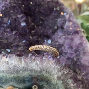 Photo of Pave Dazzle Ring in a decorative scene, designed by , available at Plumb Gold & Plumb Silver