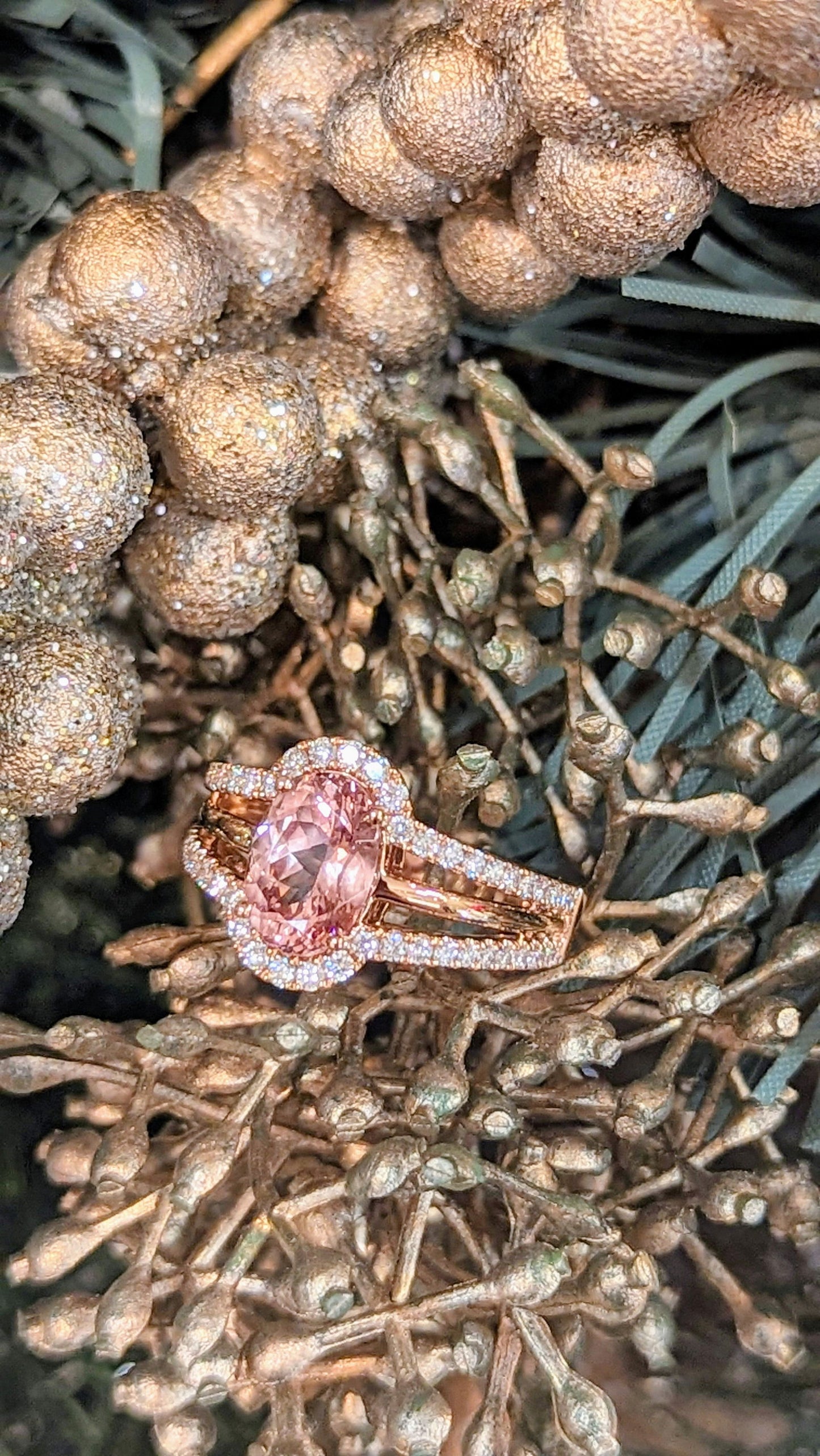 Photo of Peach Garnet Ring in a decorative scene, designed by , available at Plumb Gold & Plumb Silver