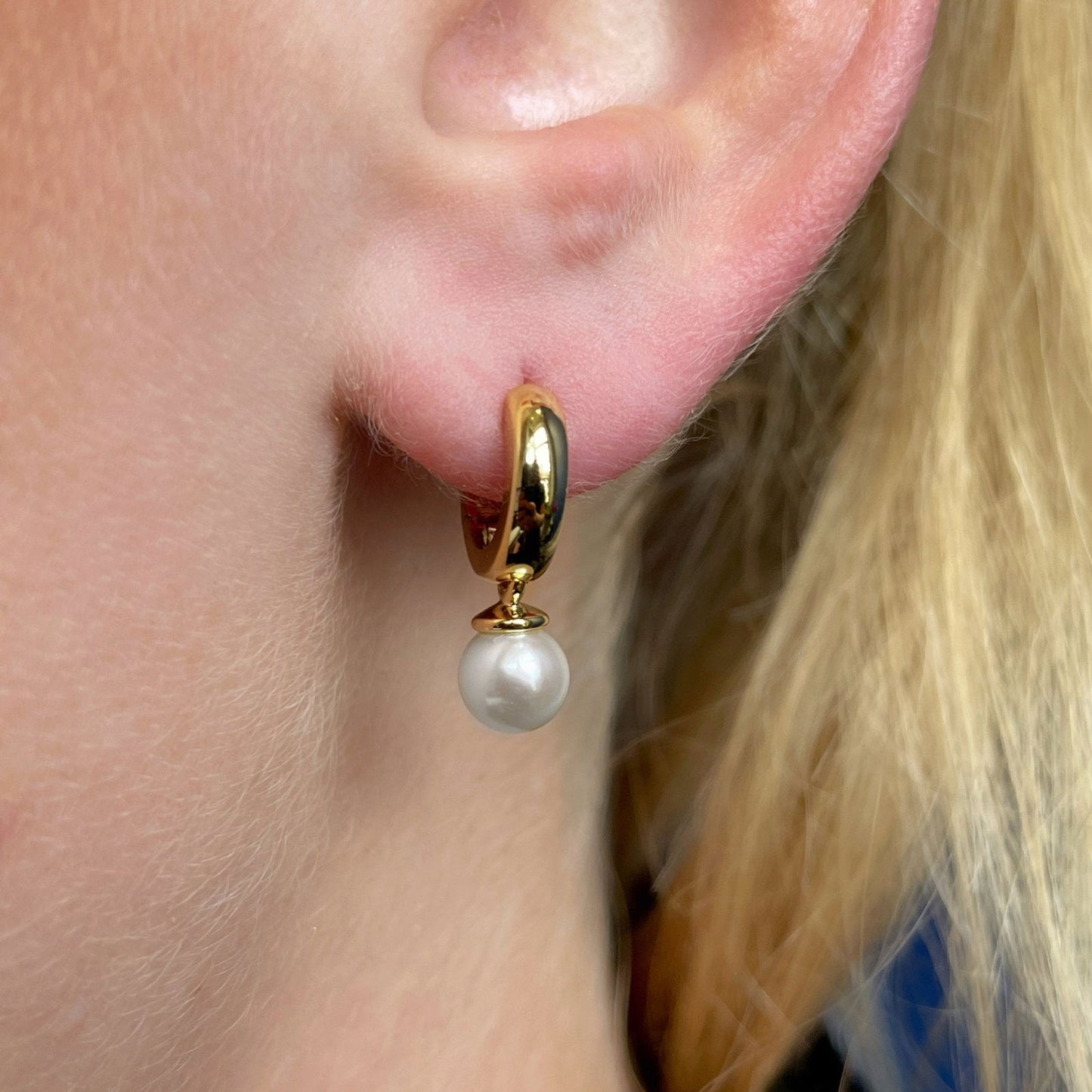 Photo of Pearl Huggies in a decorative scene, designed by , available at Plumb Gold & Plumb Silver