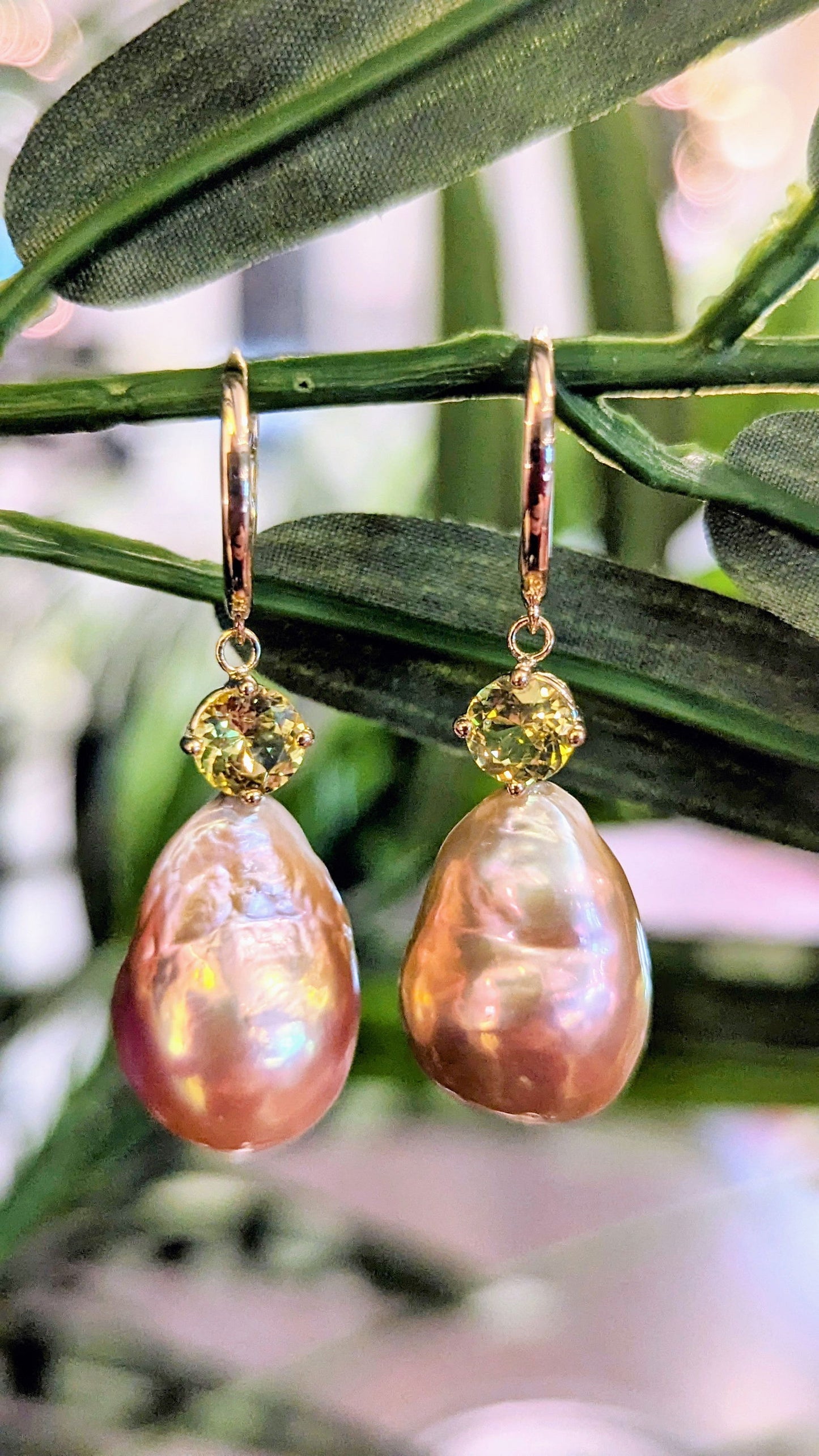 Photo of Pearl and Chrysoberyl Earrings in a decorative scene, designed by , available at Plumb Gold & Plumb Silver