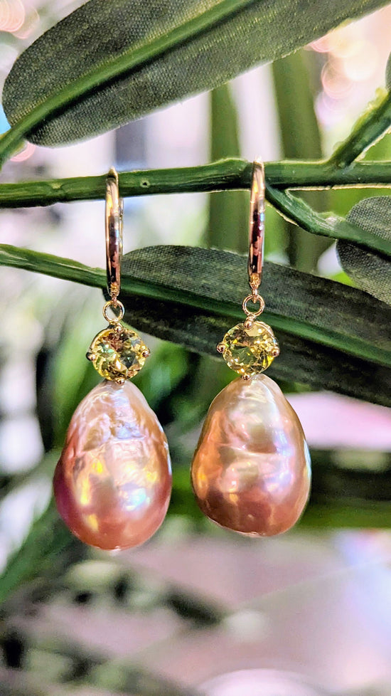Photo of Pearl and Chrysoberyl Earrings in a decorative scene, designed by , available at Plumb Gold & Plumb Silver
