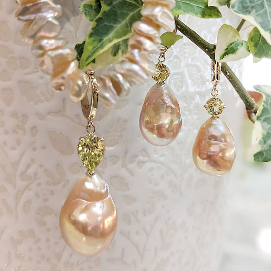 Photo of Pearl and Chrysoberyl Earrings in a decorative scene, designed by , available at Plumb Gold & Plumb Silver