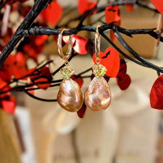 Photo of Pearl and Chrysoberyl Earrings in a decorative scene, designed by , available at Plumb Gold & Plumb Silver