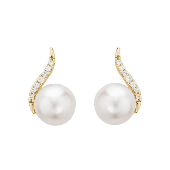 Photo of Pearl and Diamond Curve Stud in a decorative scene, designed by , available at Plumb Gold & Plumb Silver