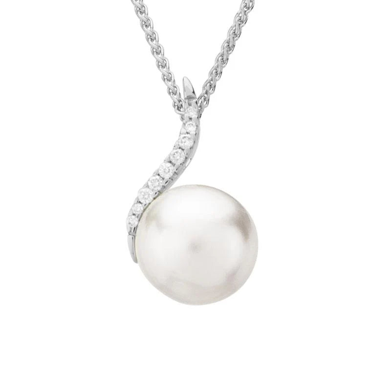 Photo of Pearl and Diamond Necklace in a decorative scene, designed by , available at Plumb Gold & Plumb Silver