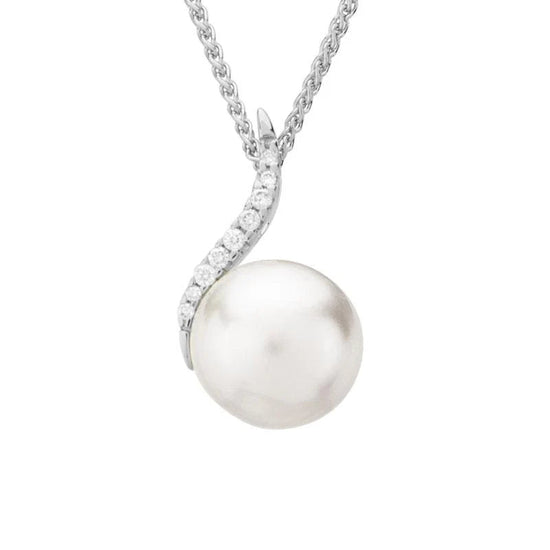 Photo of Pearl and Diamond Necklace in a decorative scene, designed by , available at Plumb Gold & Plumb Silver
