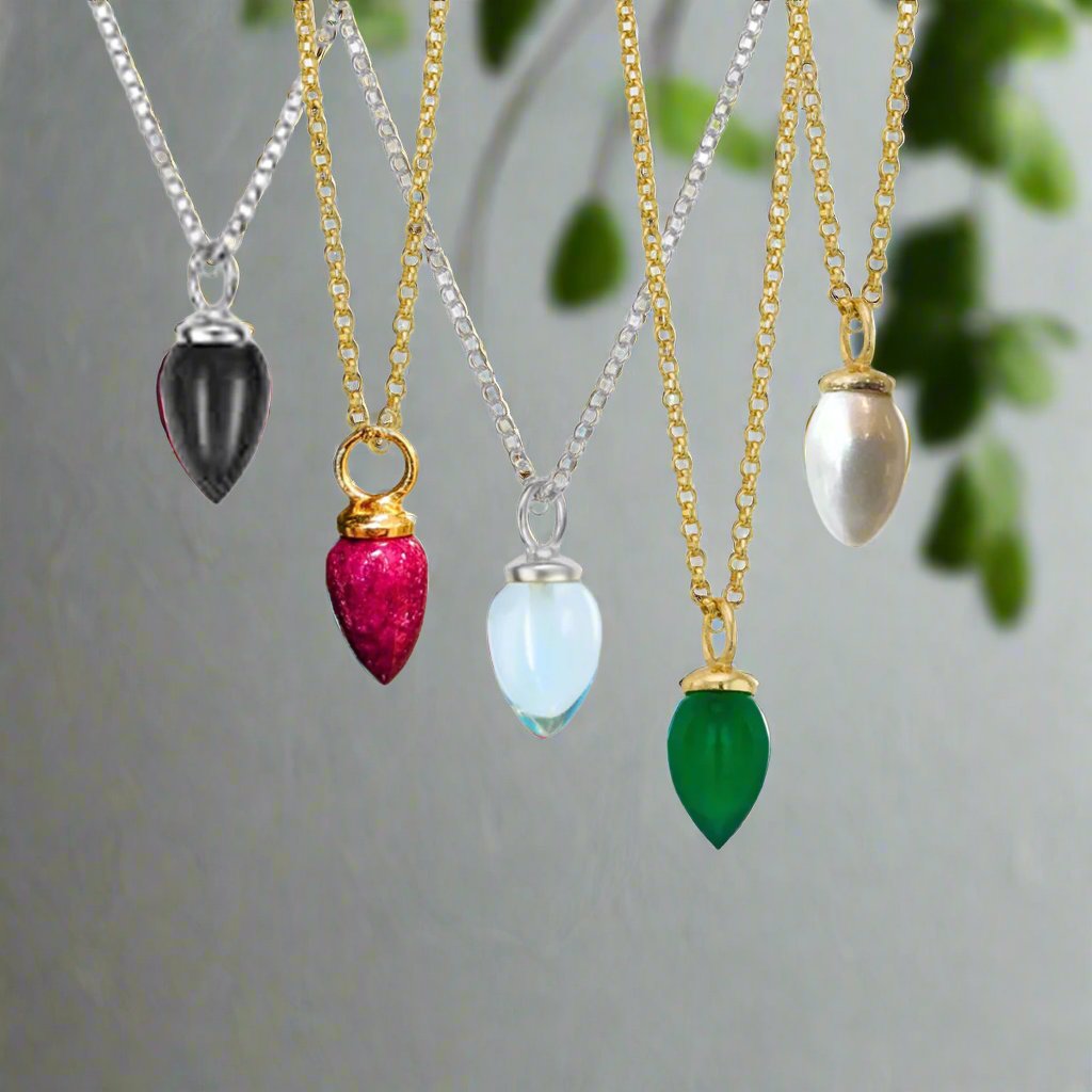 Photo of "Pendulum" pendant in a decorative scene, designed by -, available at Plumb Gold & Plumb Silver