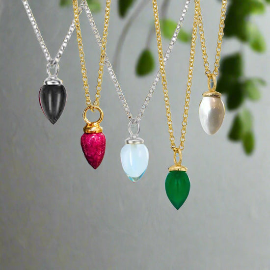 Photo of "Pendulum" pendant in a decorative scene, designed by -, available at Plumb Gold & Plumb Silver