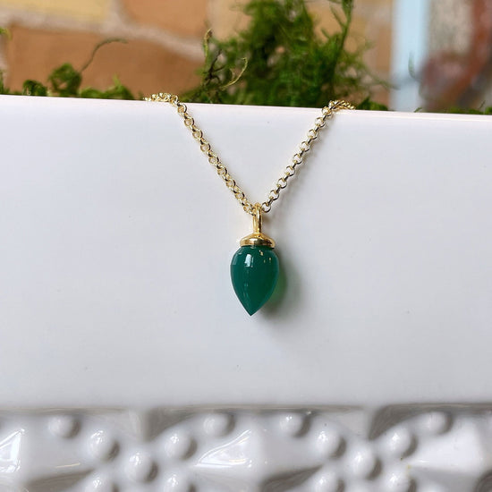 Photo of "Pendulum" pendant in a decorative scene, designed by , available at Plumb Gold & Plumb Silver
