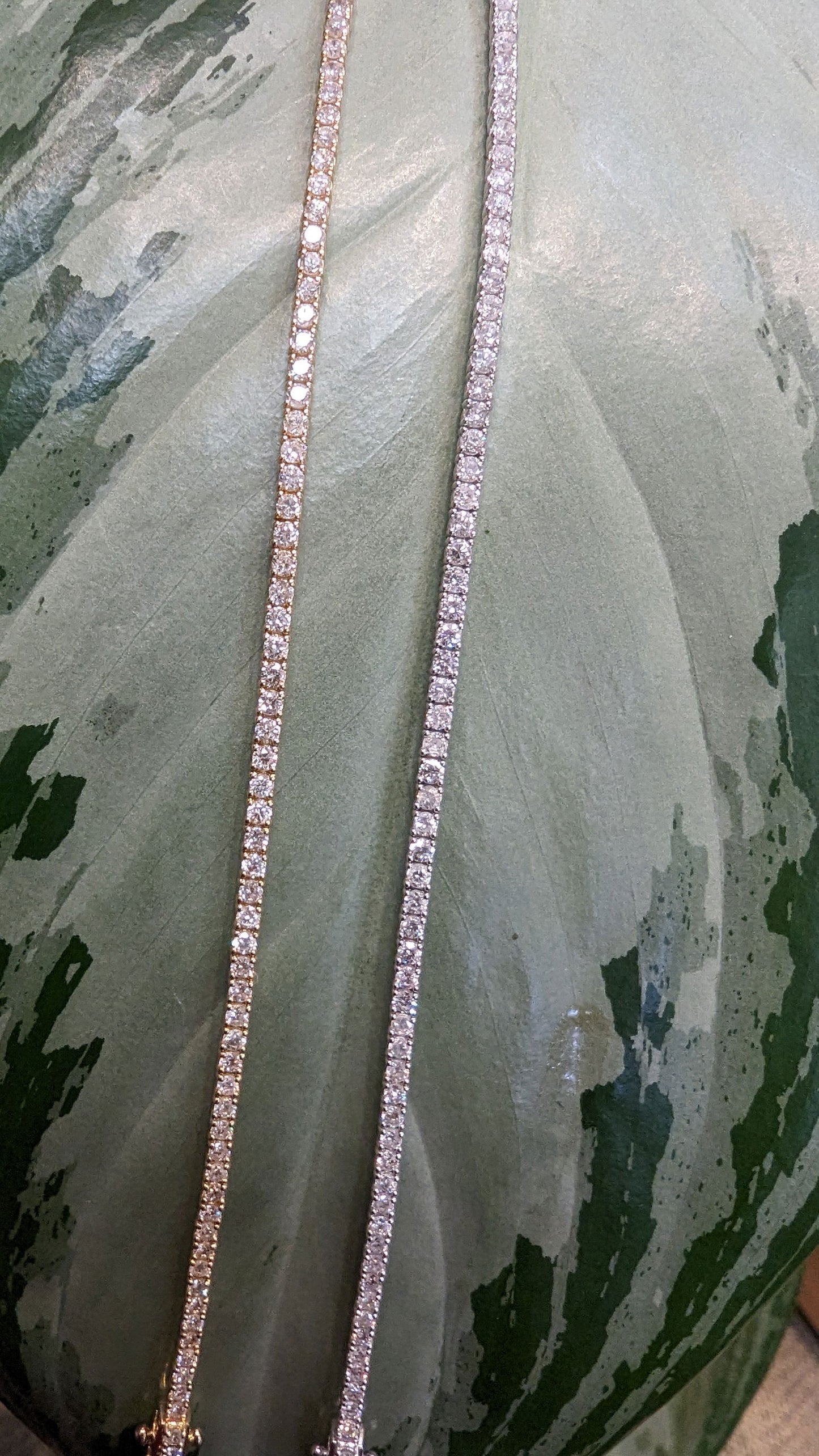 Photo of Petite Diamond Tennis Bracelet in a decorative scene, designed by , available at Plumb Gold & Plumb Silver