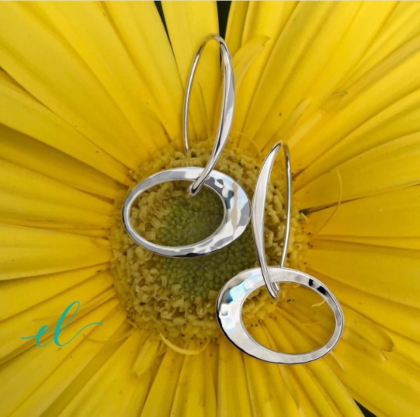 Photo of "Petite Elliptical" Earrings in a decorative scene, designed by , available at Plumb Gold & Plumb Silver