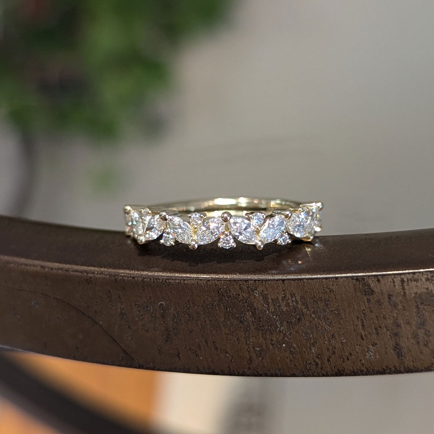 Photo of "Pia" Band in a decorative scene, designed by , available at Plumb Gold & Plumb Silver