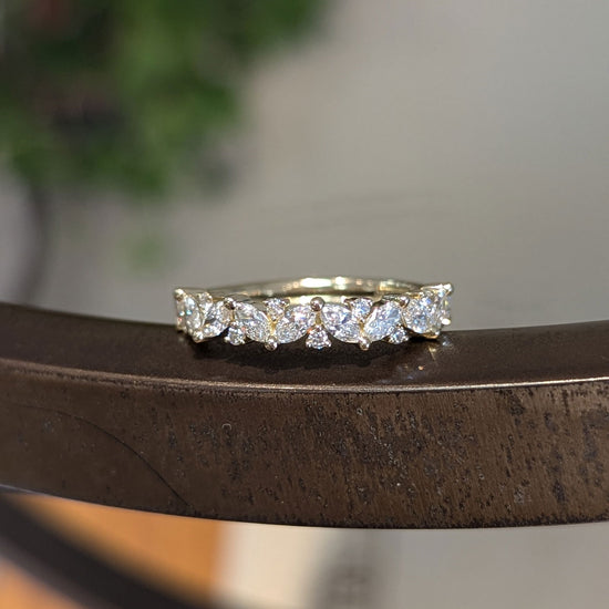 Photo of "Pia" Band in a decorative scene, designed by , available at Plumb Gold & Plumb Silver