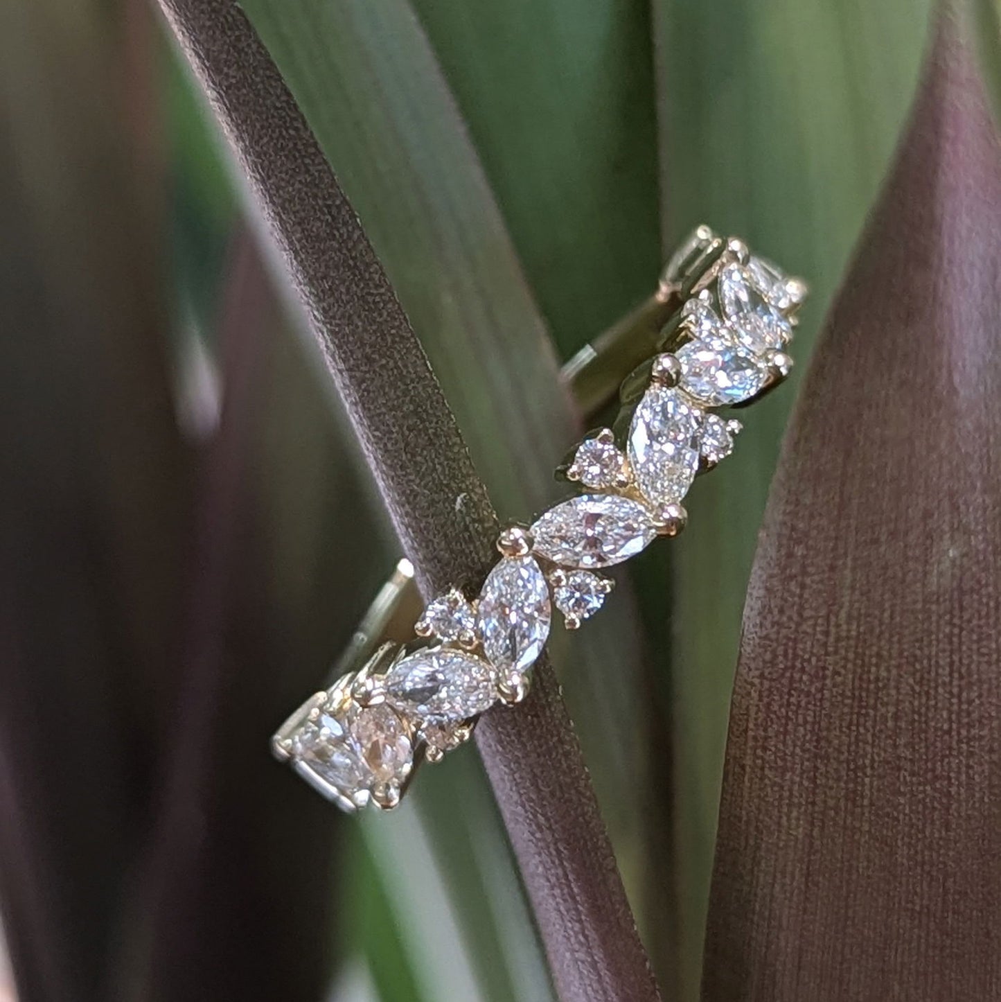 Photo of "Pia" Band in a decorative scene, designed by , available at Plumb Gold & Plumb Silver