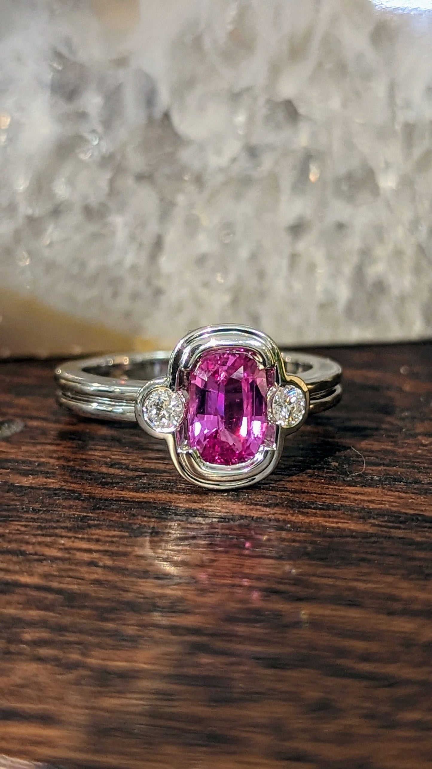 Photo of Pink Sapphire Ring in a decorative scene, designed by , available at Plumb Gold & Plumb Silver