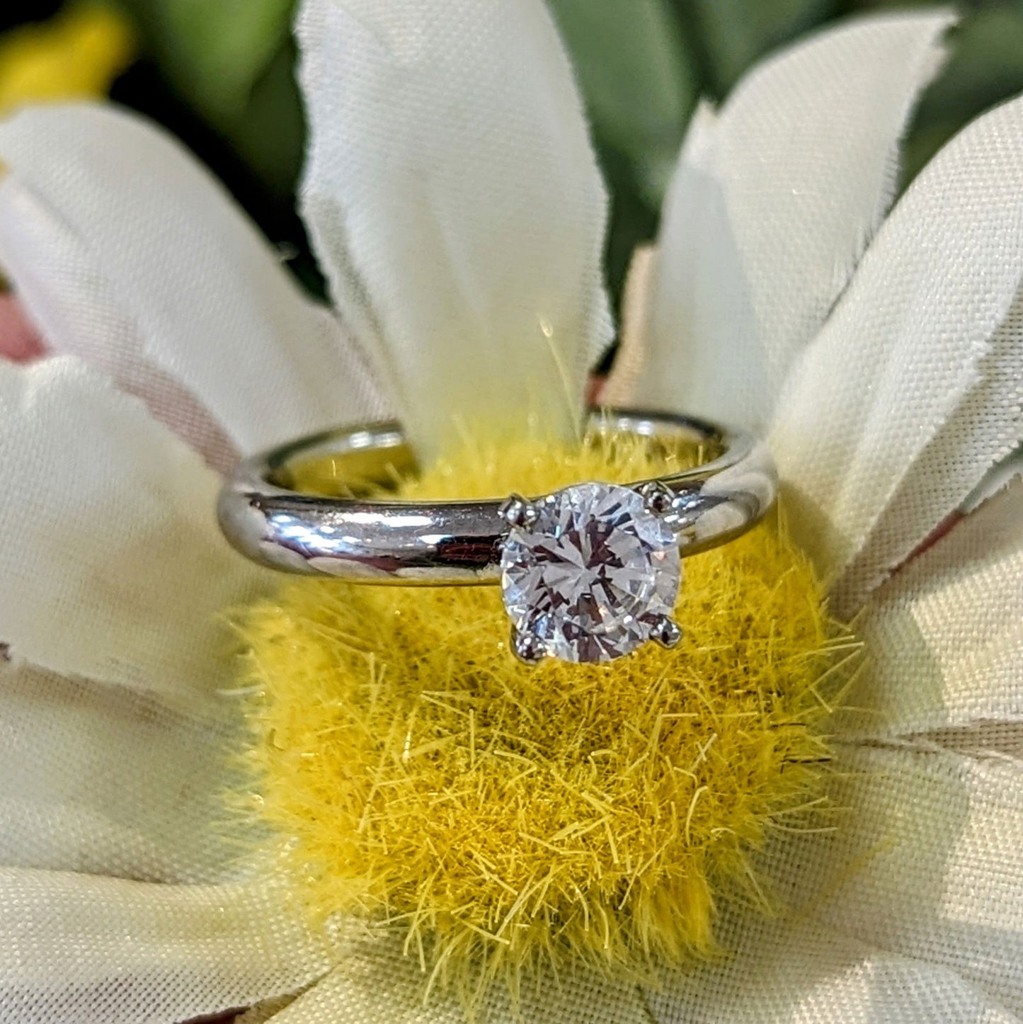 Photo of Platinum Classic Solitaire in a decorative scene, designed by , available at Plumb Gold & Plumb Silver
