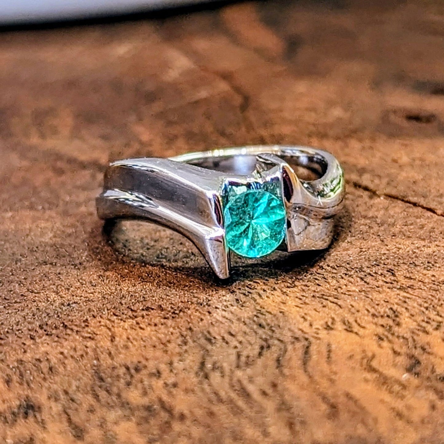 Photo of Plumb Gold Original Emerald Ring in a decorative scene, designed by , available at Plumb Gold & Plumb Silver
