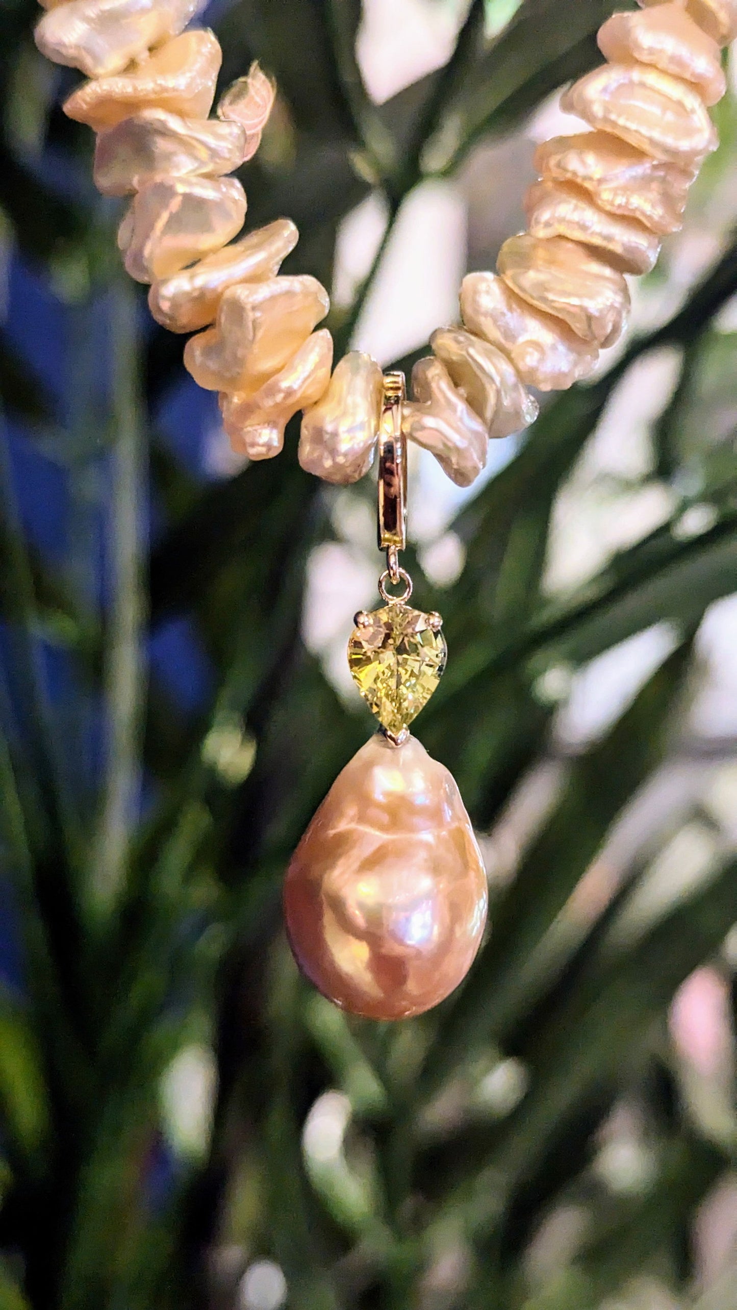 Photo of Plumb Gold Original Pearl Enhancer Pendant in a decorative scene, designed by , available at Plumb Gold & Plumb Silver